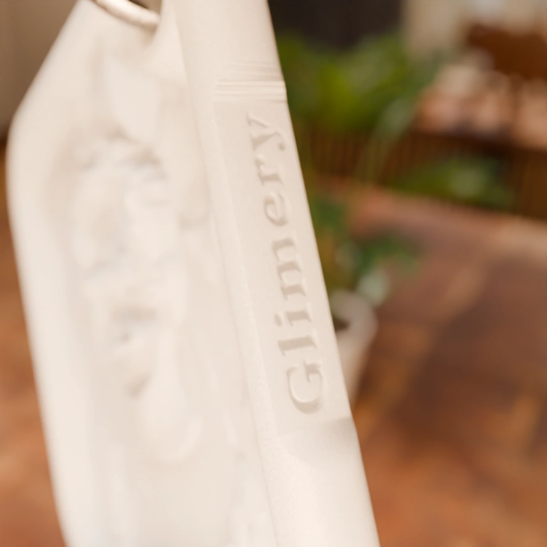Glimery square photo keychain, close-up of the Glimery engraving in the edge.