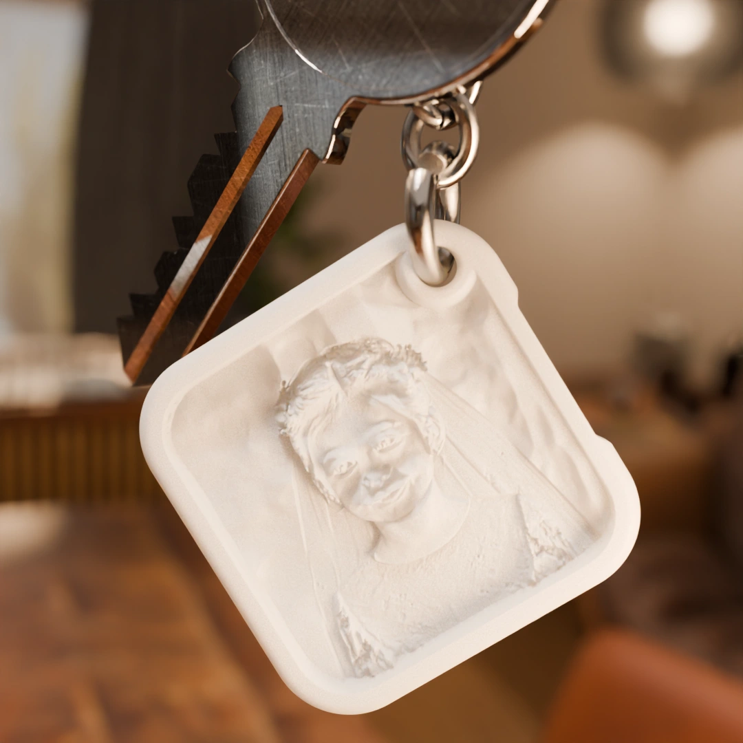 Glimery square photo keychain with a portrait photo, without backlighting, showing the raised texture of the photo surface.